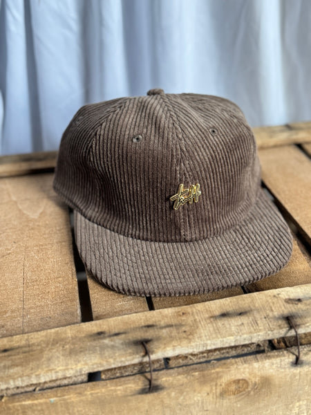 the “Signature Pin” hat