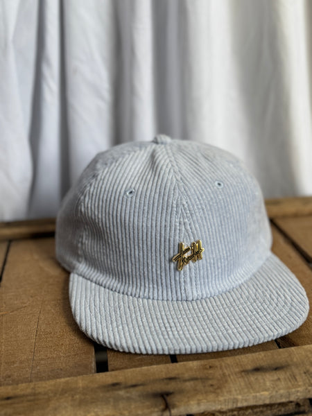 the “Signature Pin” hat