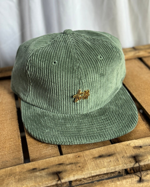 the “Signature Pin” hat