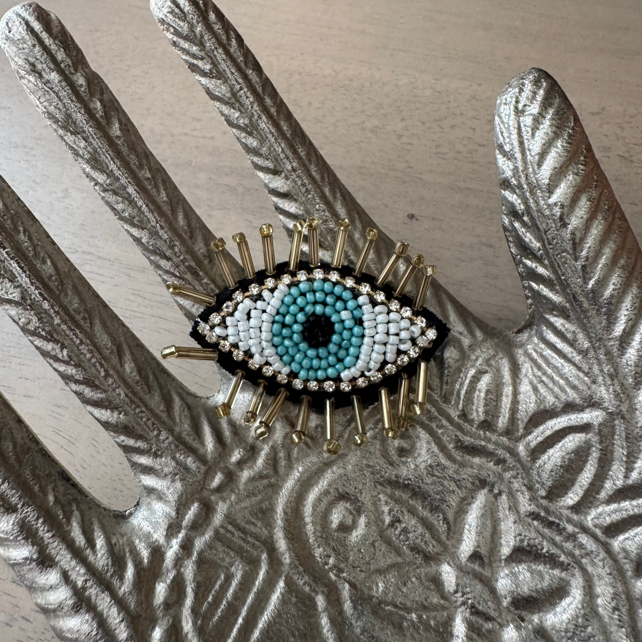 the "Beaded Evil Eye" brooch pin